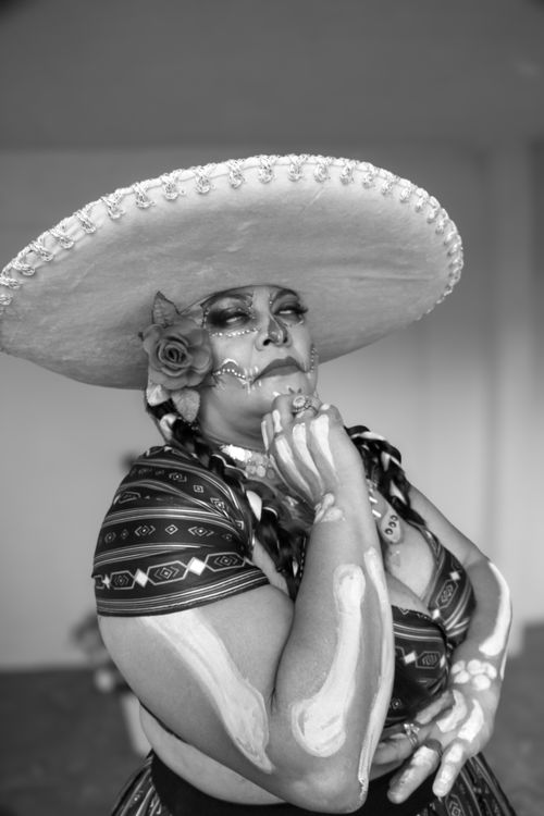Free Black and white portrait of a woman in traditional Dia de los Muertos makeup and attire. Stock Photo