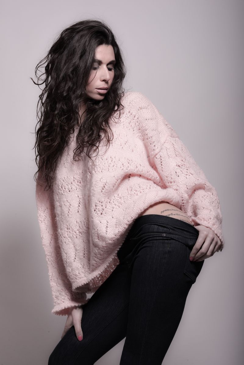 Woman in pink knit sweater