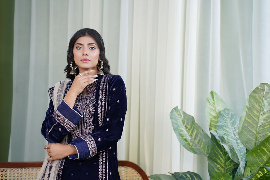 Stylish South Asian fashion model in elegant traditional clothing with open neckline