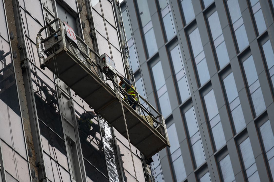 Hi Rise Window Cleaners High-Rise Window Cleaners on Suspended Platform · Free Stock Photo