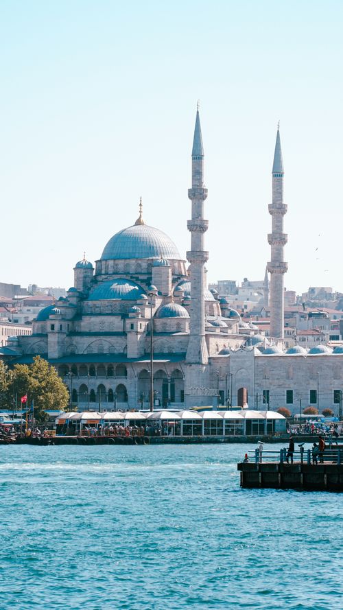 Free Stunning view of the Yeni Cami mosque with the Bosphorus in Istanbul, under a clear blue sky. Stock Photo