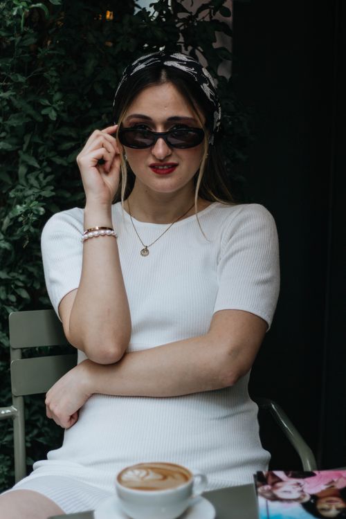 Free Casual portrait of a woman sipping coffee outdoors in Istanbul, Turkey. Stock Photo