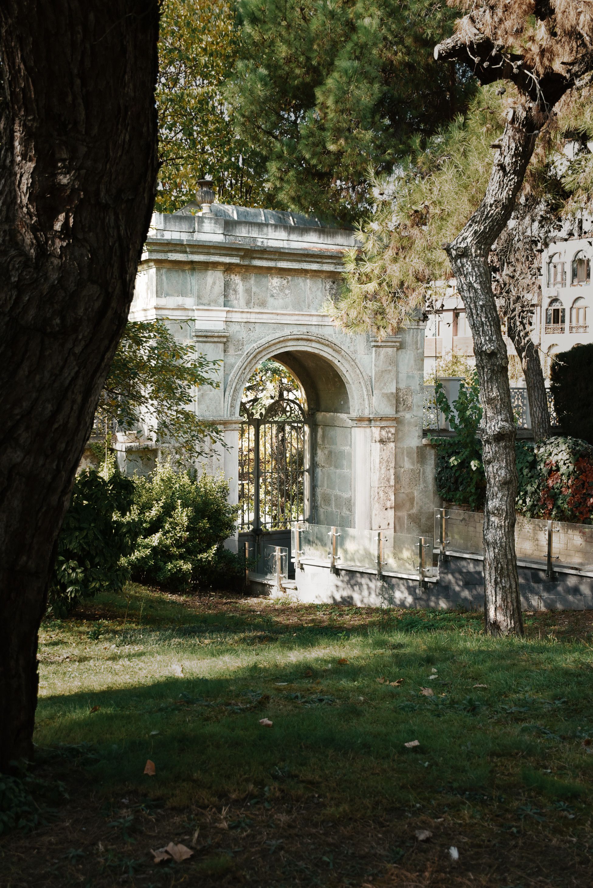 Ancient Stone Archway in Lush Green Park Setting · Free Stock Photo