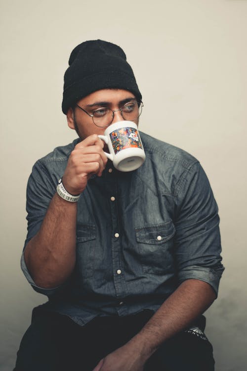 Free Man Drinking from Mug Stock Photo