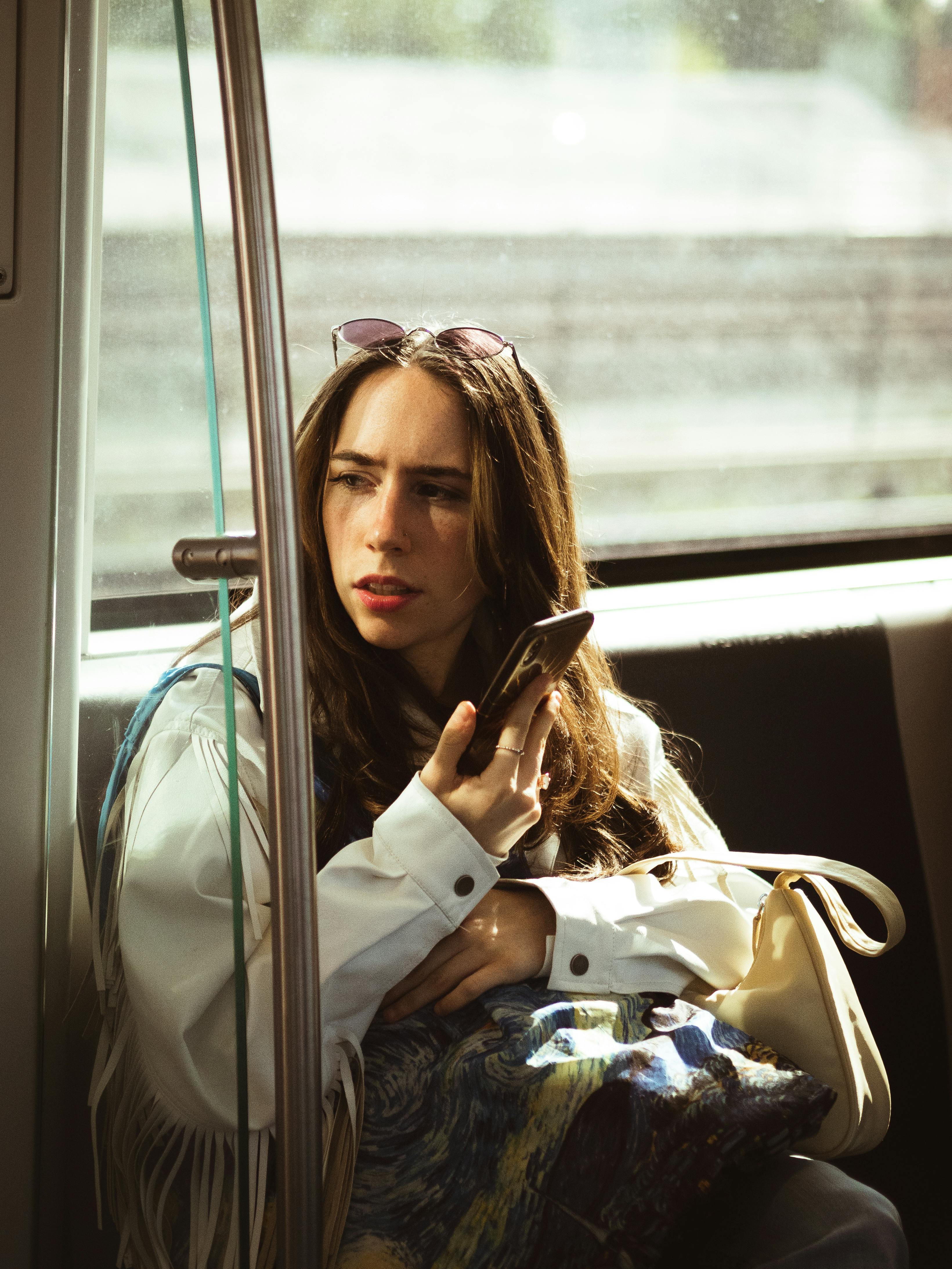 young woman traveling on amsterdam tram