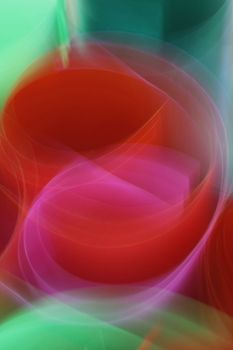 Dynamic abstract image with swirling vibrant colored light trails.
