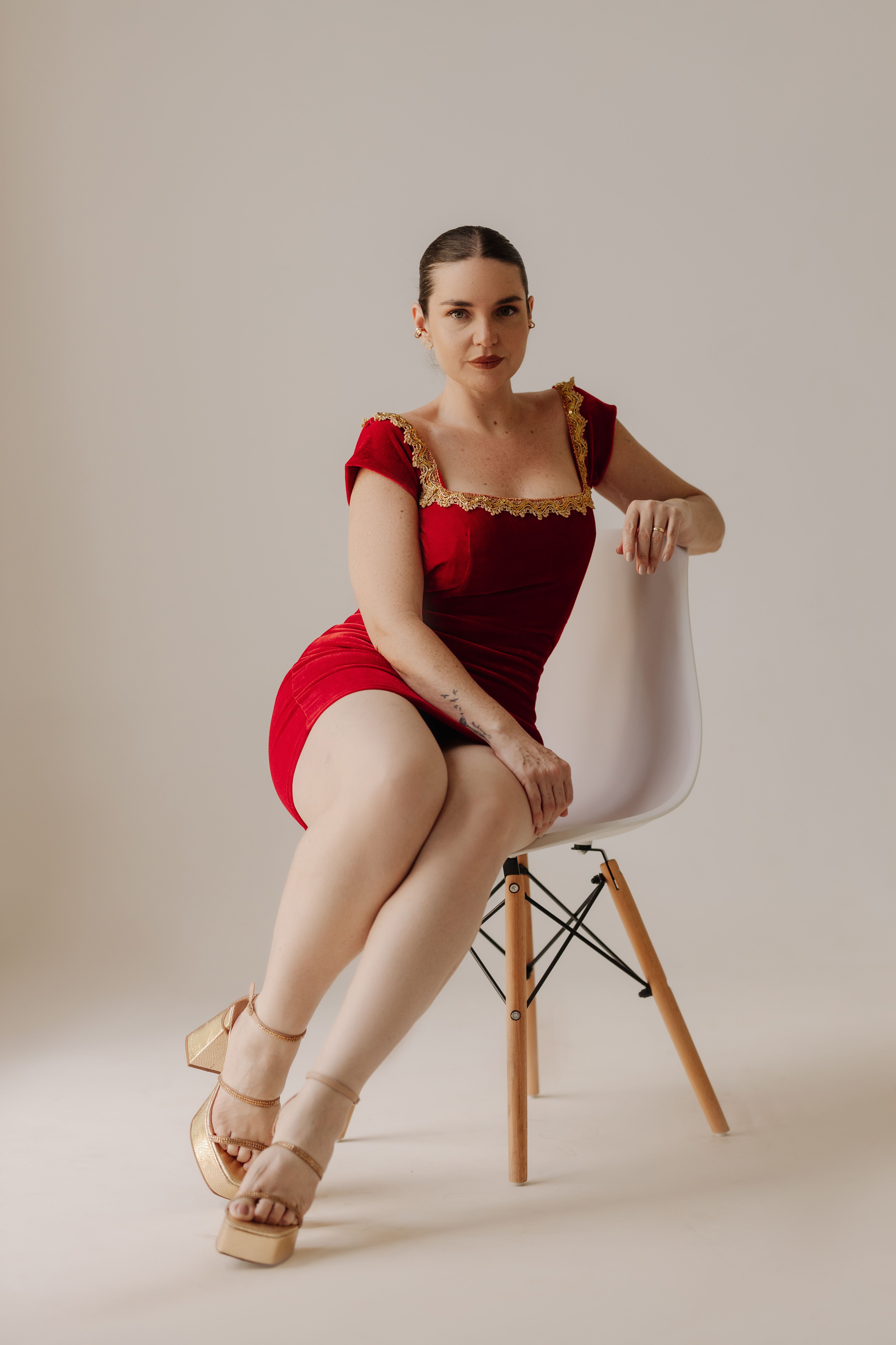 Elegant Woman in Red Dress Sitting on Chair · Free Stock Photo