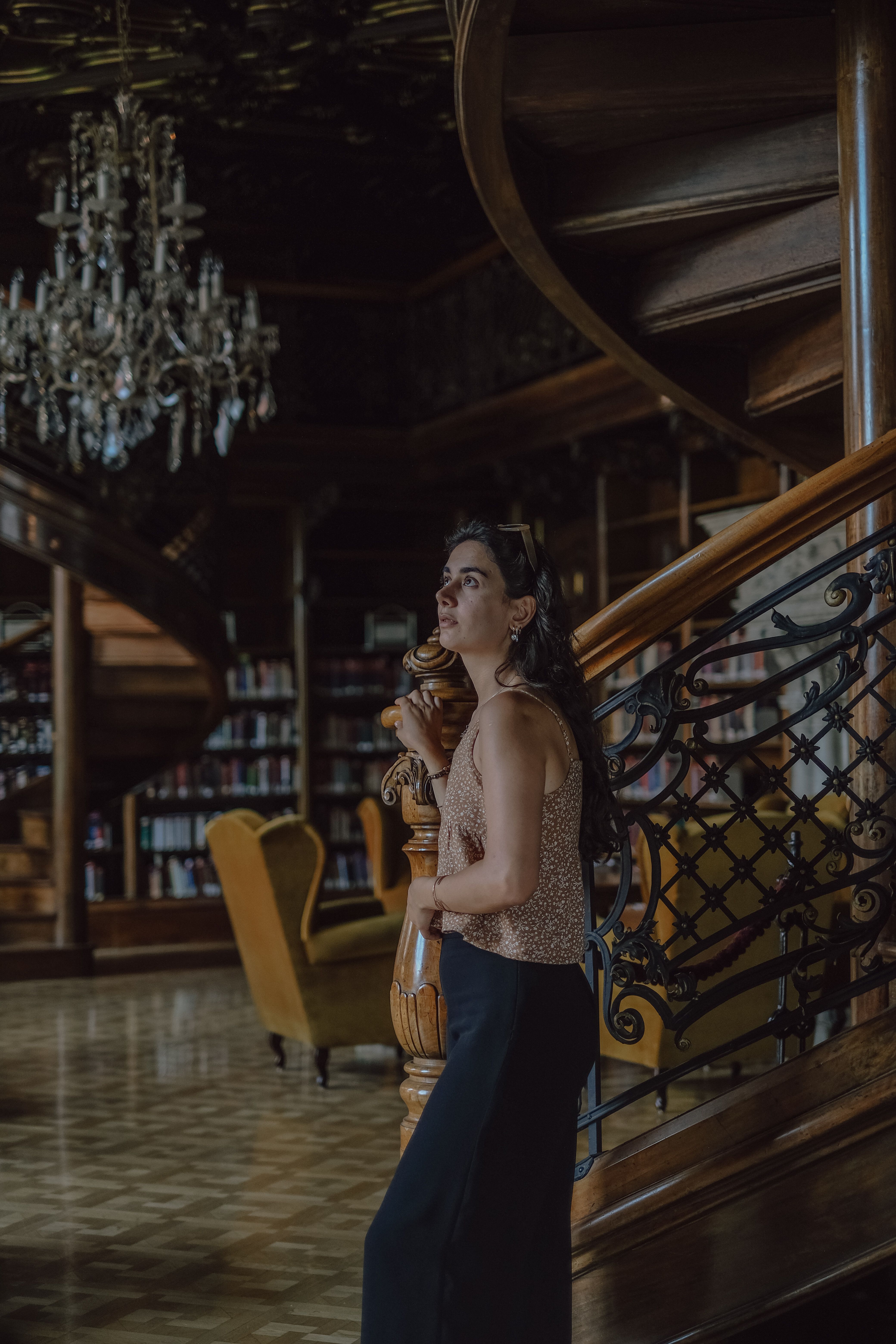 Elegant Woman in Luxurious Library Setting · Free Stock Photo