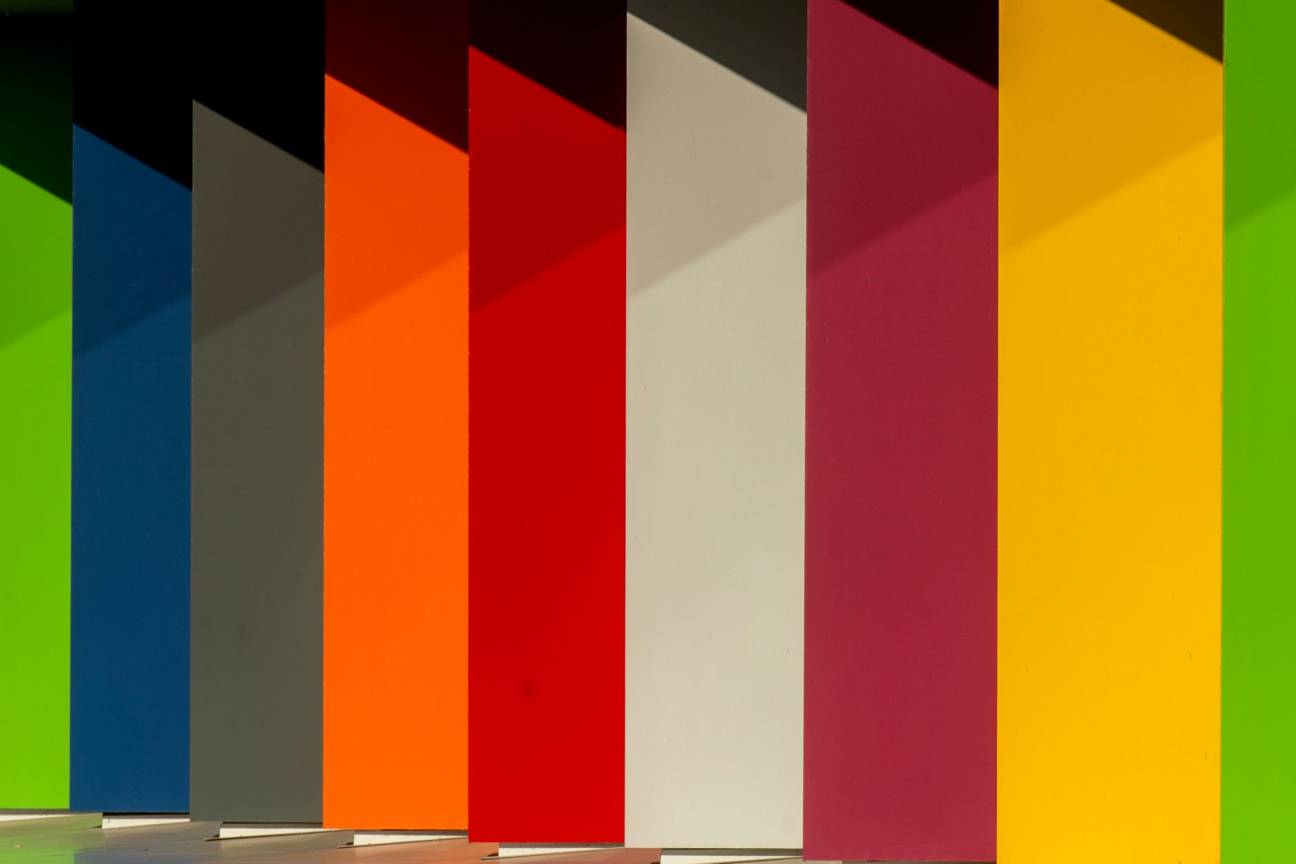 https://www.pexels.com/photo/colorful-shadows-on-geometric-wall-outdoors-29419681/