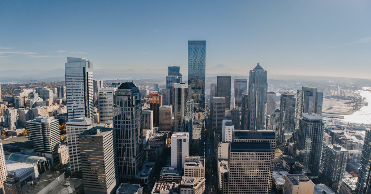 Breathtaking aerial view of Seattle's skyline featuring iconic skyscrapers on a clear day.