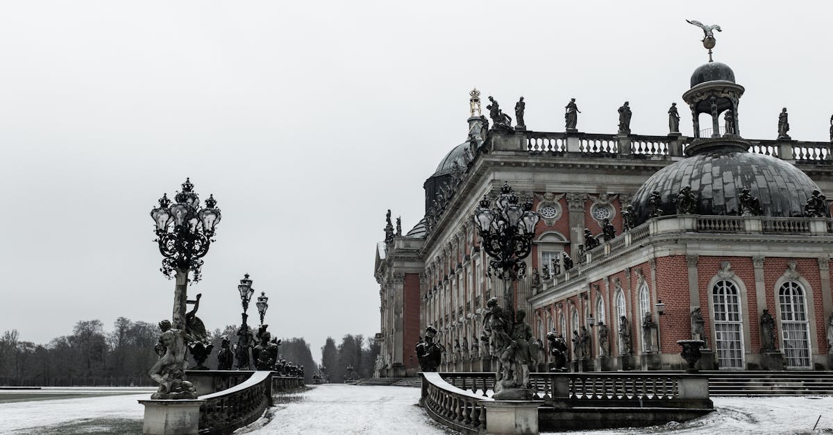 Snow-covered scene of the baroque Neues Palais in Potsdam, Germany, in winter.