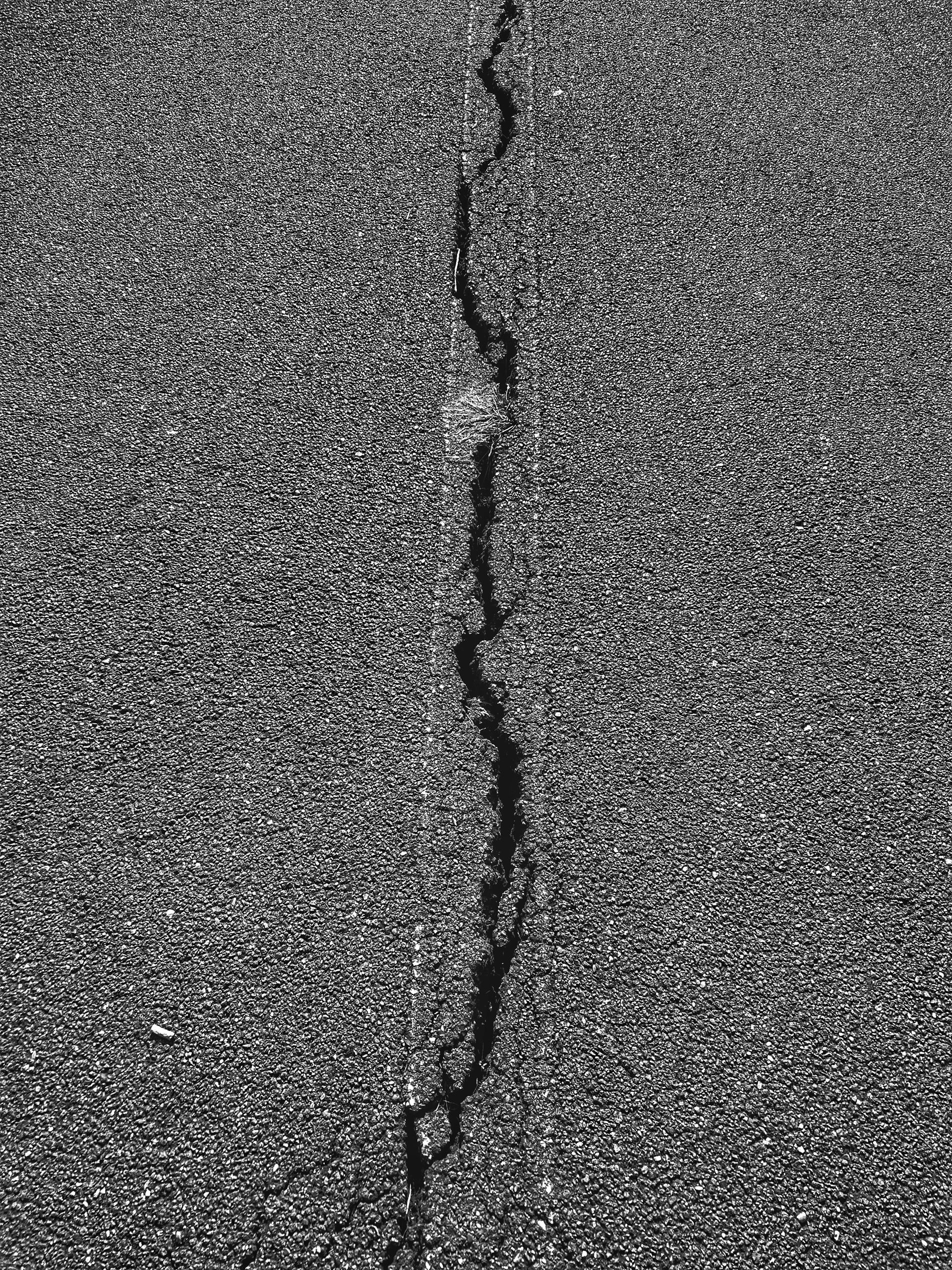 Asphalt surface with cracks ready for hot-applied sealant