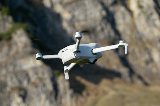 A drone flying near rocky mountains in Walenstadt, Switzerland.