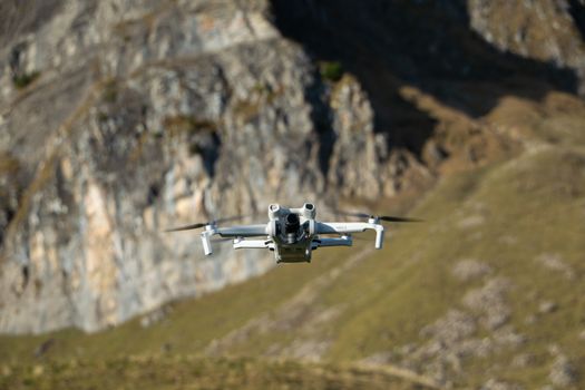 Aerial view of a drone navigating the rocky cliffs of Walenstadt, capturing stunning landscapes.