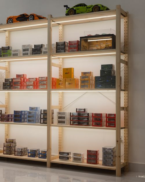 Free Shelves filled with model cars and toy boxes in a Cambodian store display. Stock Photo
