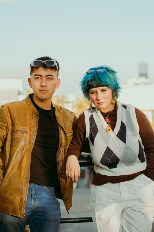 Free Two stylish young adults posing in an outdoor urban environment. Stock Photo