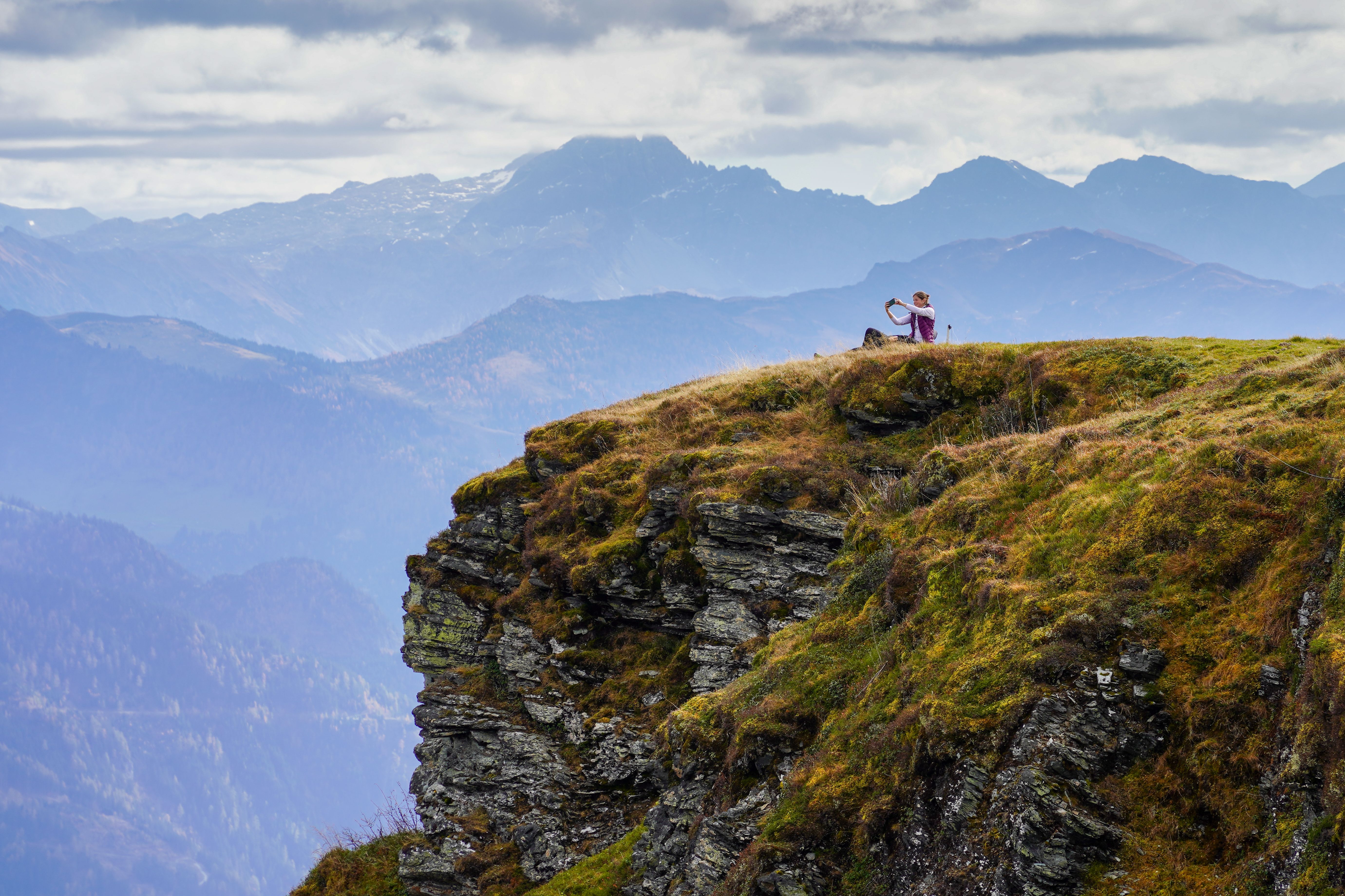 Woman Exploring Scenic Mountainscape · Free Stock Photo