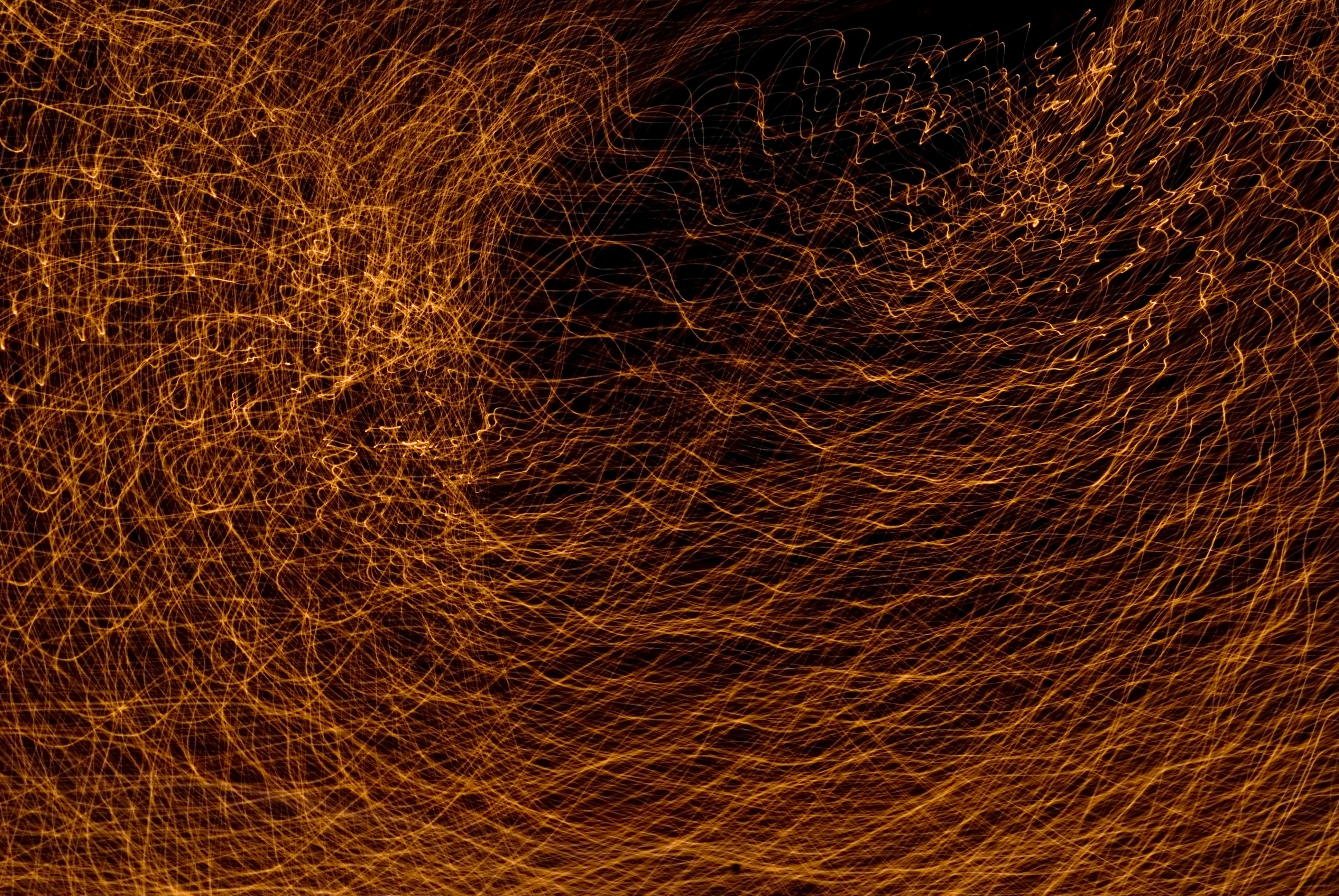 A dynamic abstract light painting with vivid swirling lines creating an energetic visual.