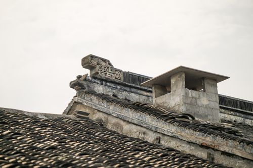 Free Close-up view of a traditional Asian architectural roof with intricate details. Stock Photo