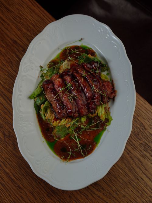 Free Delicious grilled steak on a bed of fresh salad with microgreens, perfect for fine dining. Stock Photo