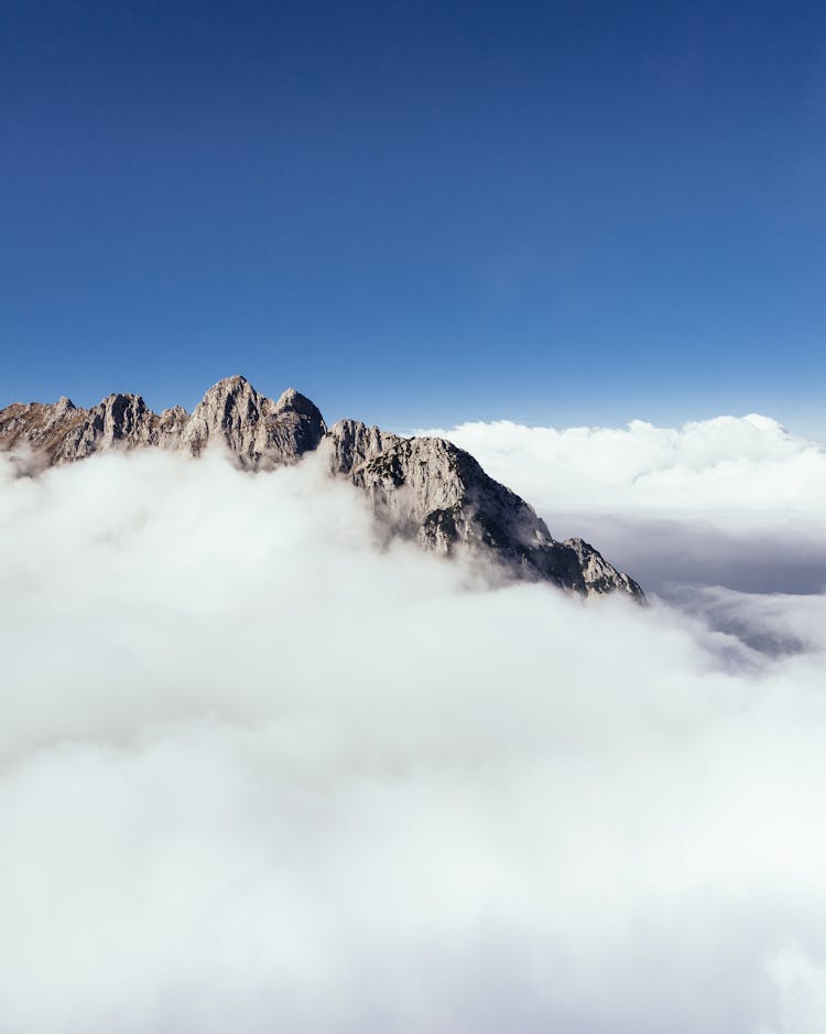 Aerial Photography Of Mountain Covered With Thick Cloud Formation