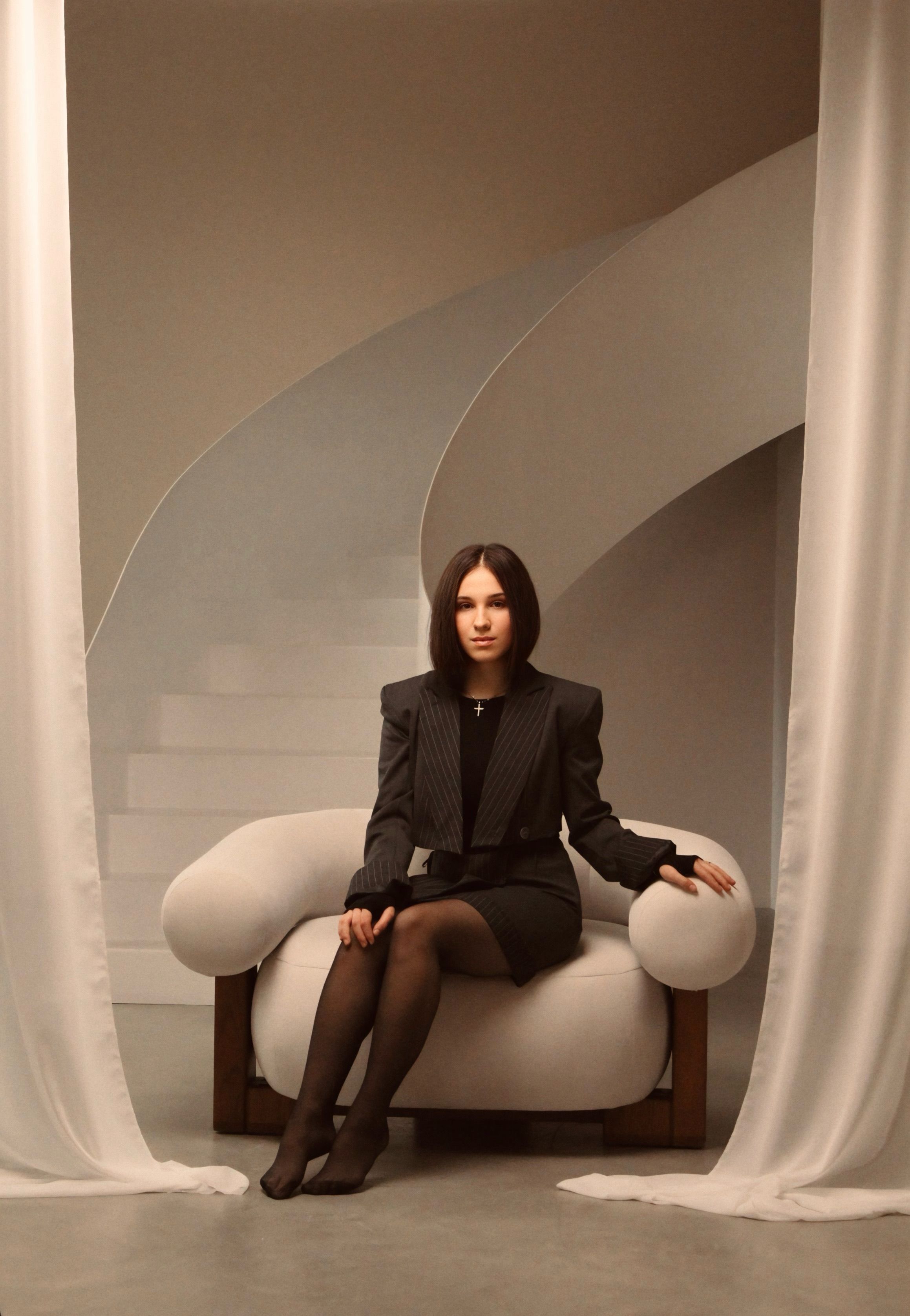 Elegant Woman Seated in Modern Interior · Free Stock Photo