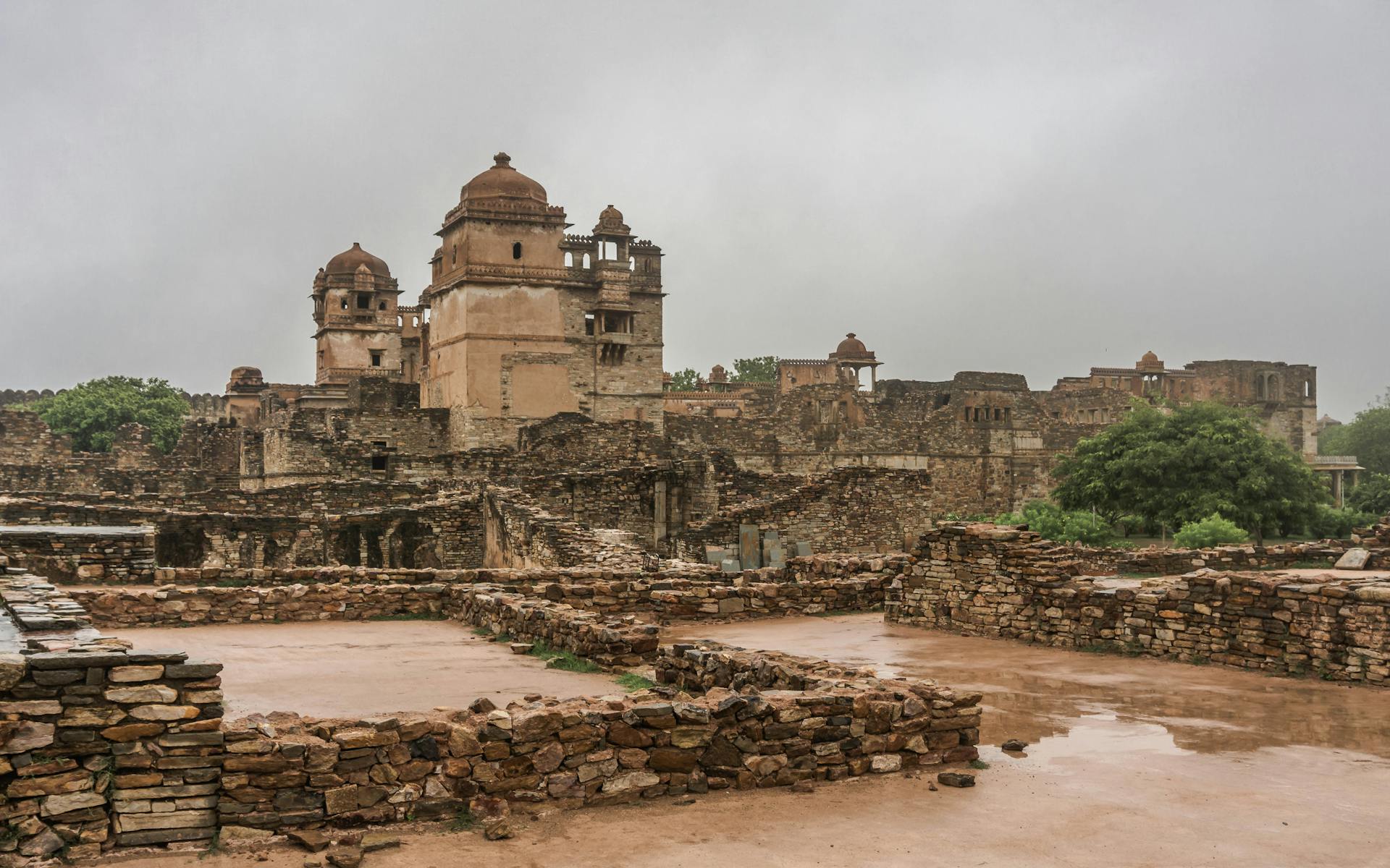 Exploring the ancient Chittorgarh Fort in Rajasthan, India, with its stone structures and historical significance.