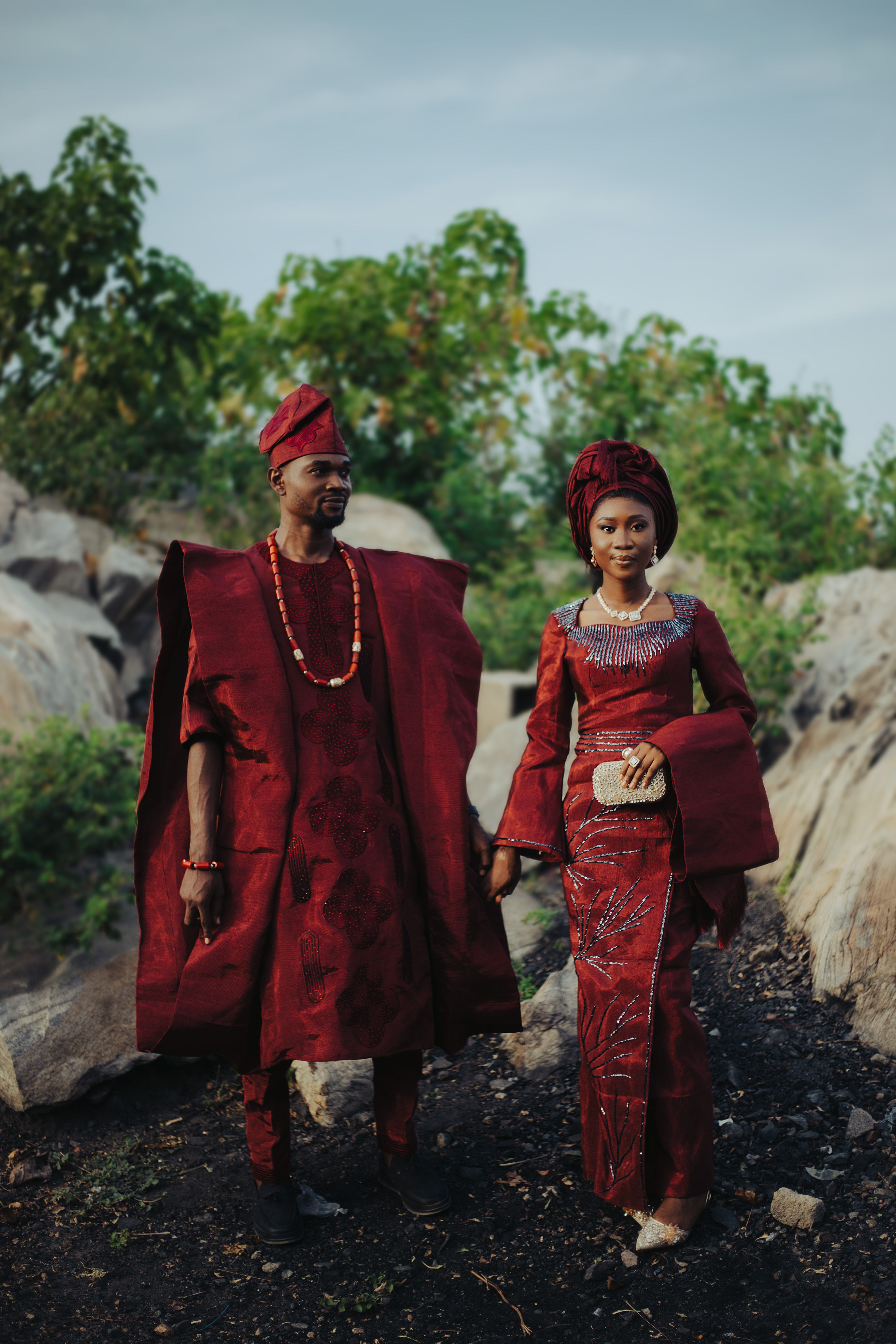 A couple in traditional African attire outdoors