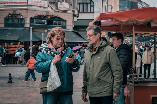 Free Capturing daily life in Istanbul with people engaging at a bustling street market. Stock Photo