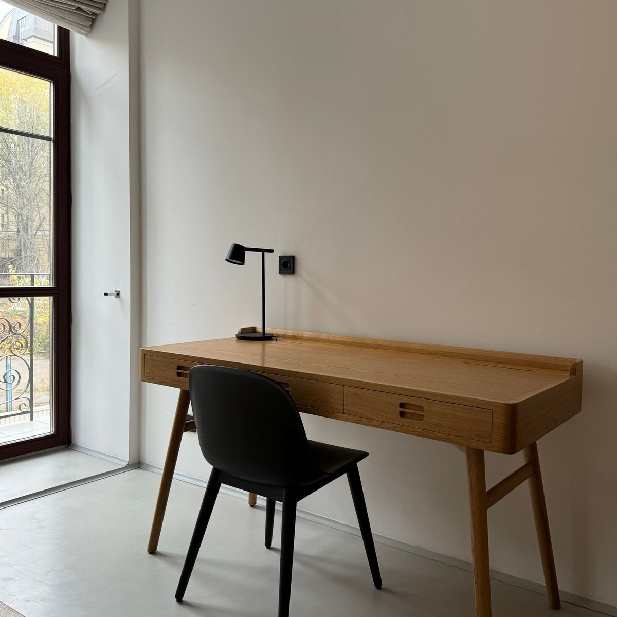 Minimal wooden study desk with chair and lamp