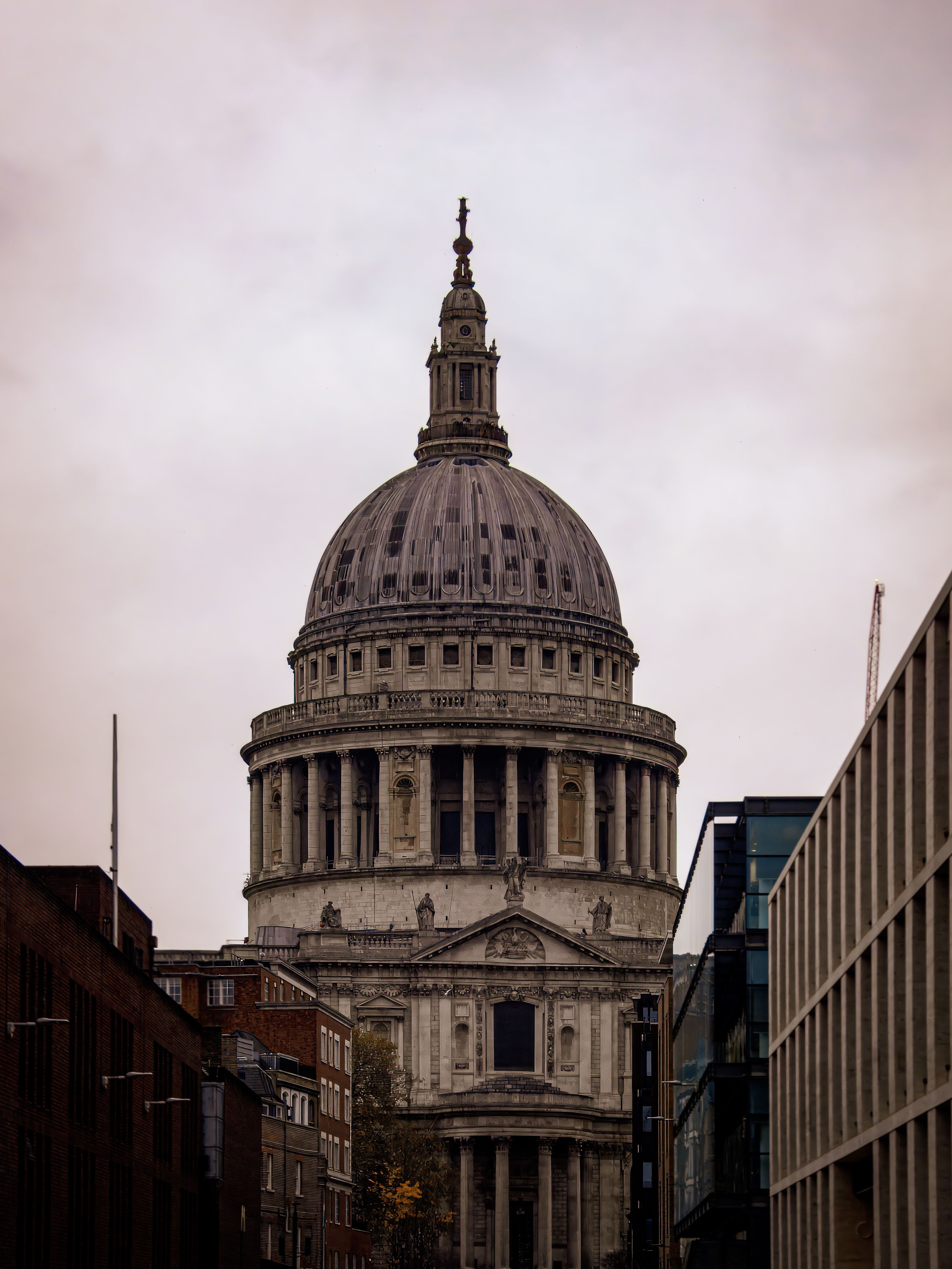 St. Paul's Cathedral in London, showcasing its iconic dome amidst surrounding architecture.