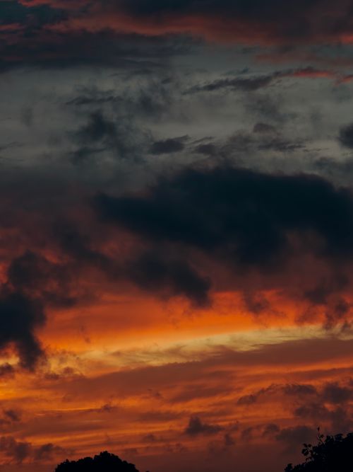Free Vibrant sunset with dramatic clouds in La Habana, Cuba, creating a stunning sky view. Stock Photo