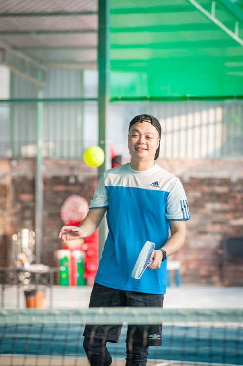 Free A young man enjoying a game of table tennis inside a sports facility in Hanoi, Vietnam. Stock Photo