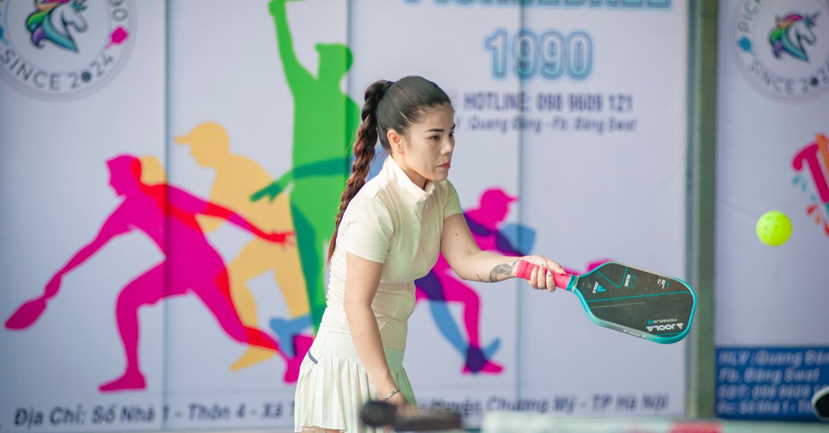 crowded pickleball courts in a city park with players of all ages, 2025