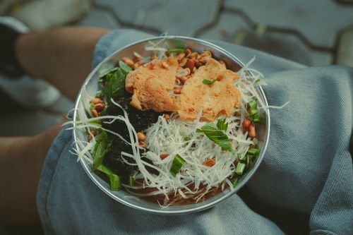 Free A vibrant Vietnamese salad featuring fresh ingredients captured in Ho Chi Minh City. Stock Photo