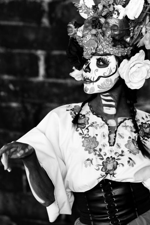 Free Black and white portrait of a Catrina with traditional makeup and floral headdress in Mexico City. Stock Photo