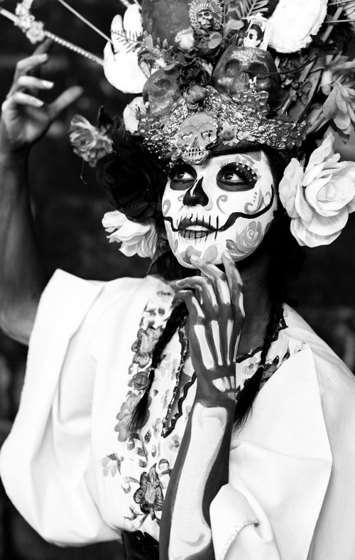Free Striking Catrina makeup emphasizes Mexican cultural heritage in black-and-white portrait. Stock Photo