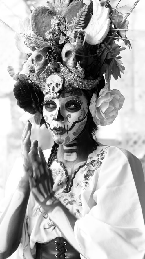 Free A woman adorned in traditional Day of the Dead makeup and attire in Mexico City, Mexico. Stock Photo