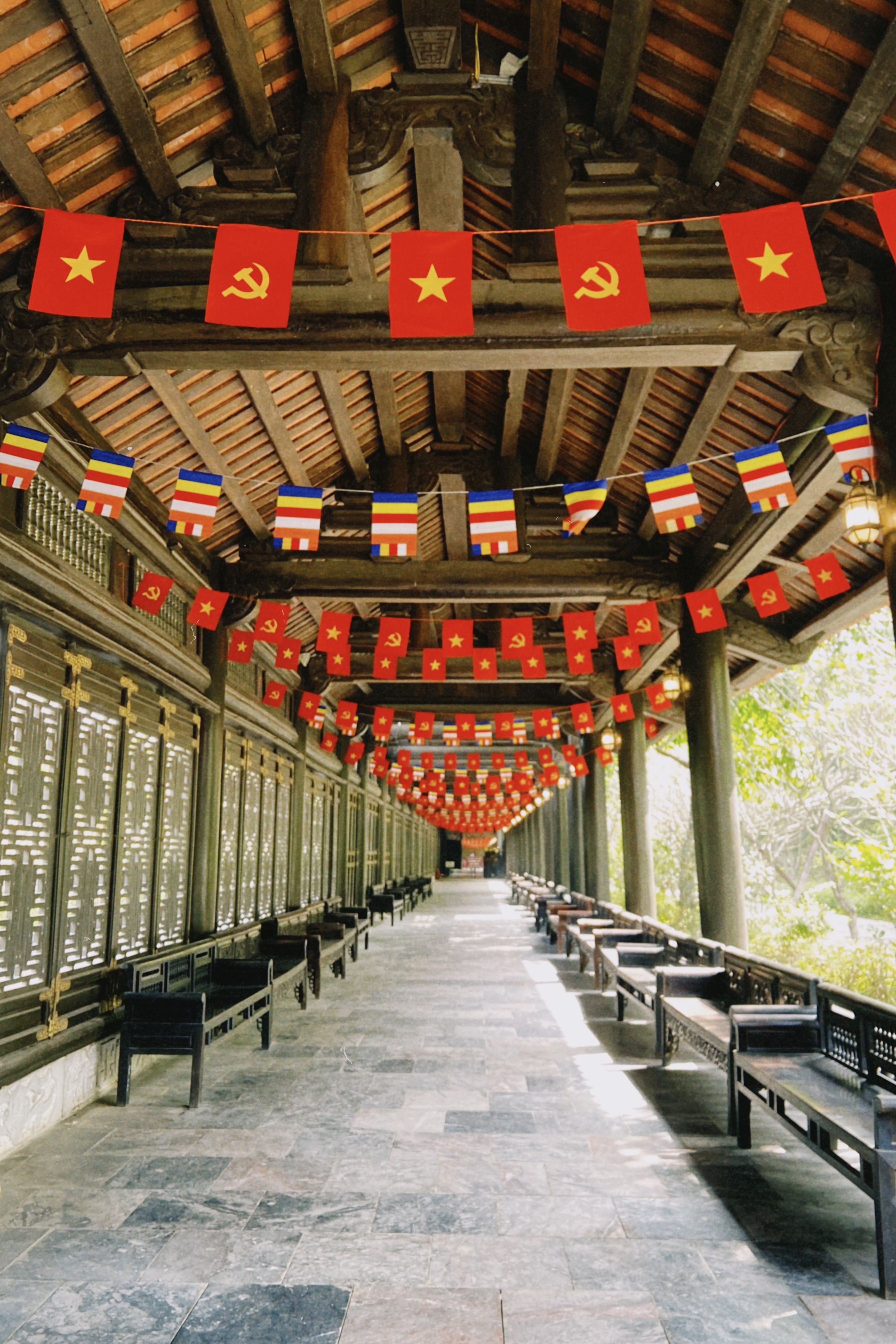 Traditional Vietnamese Corridor with Flags · Free Stock Photo