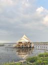 Brown Wooden Dock on Body of Water Under Cloudy Sky