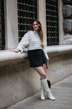 Stylish woman posing in a trendy outfit on a historic street in Istanbul, capturing modern fashion in an ancient city.