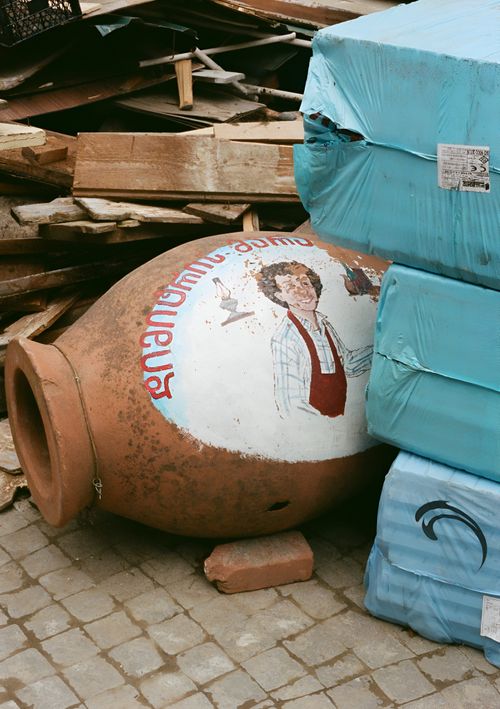 Free Close-up of a vintage painted pottery jar amidst construction materials in Borjomi, Georgia. Stock Photo