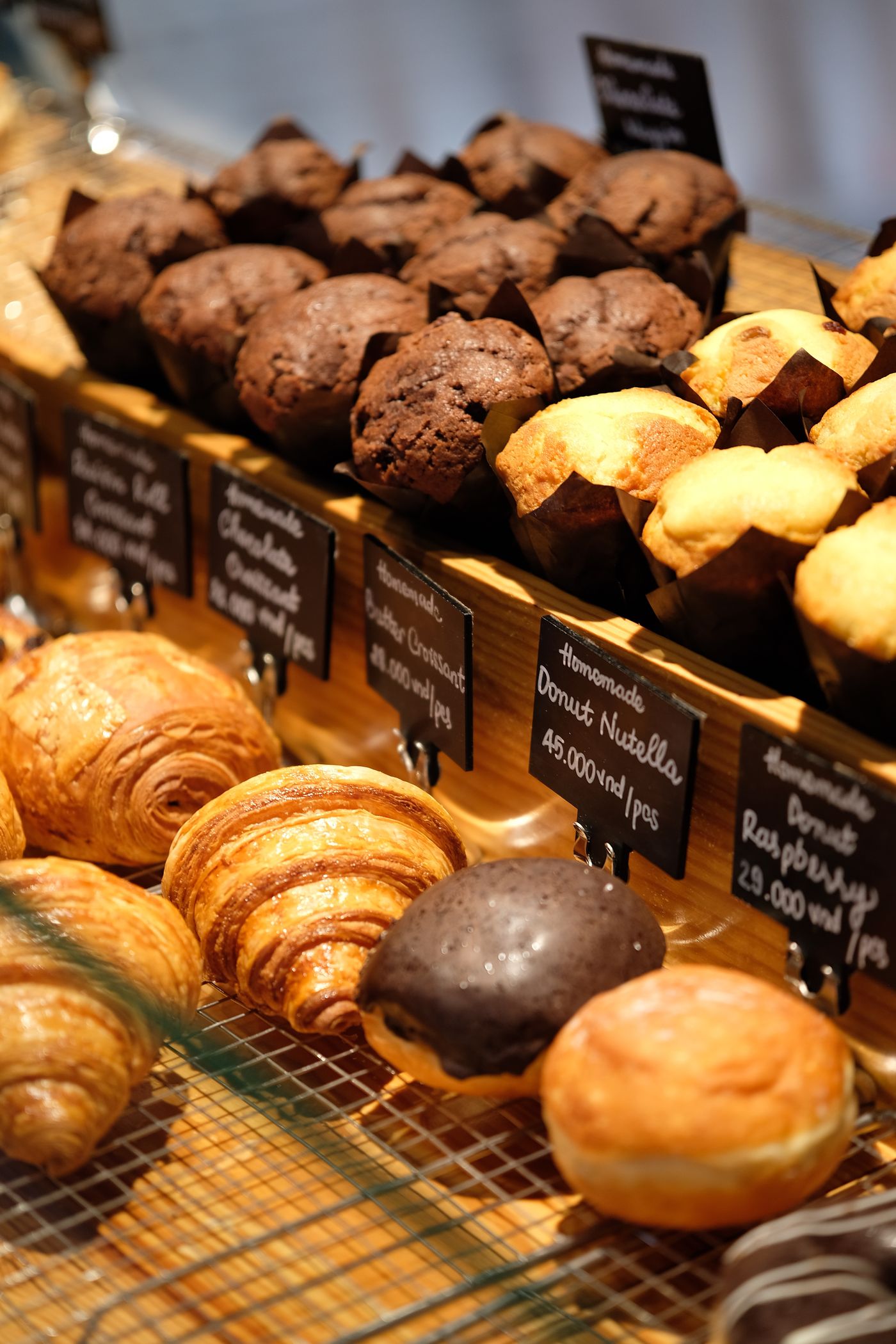 Freshly baked croissants and muffins in a bakery