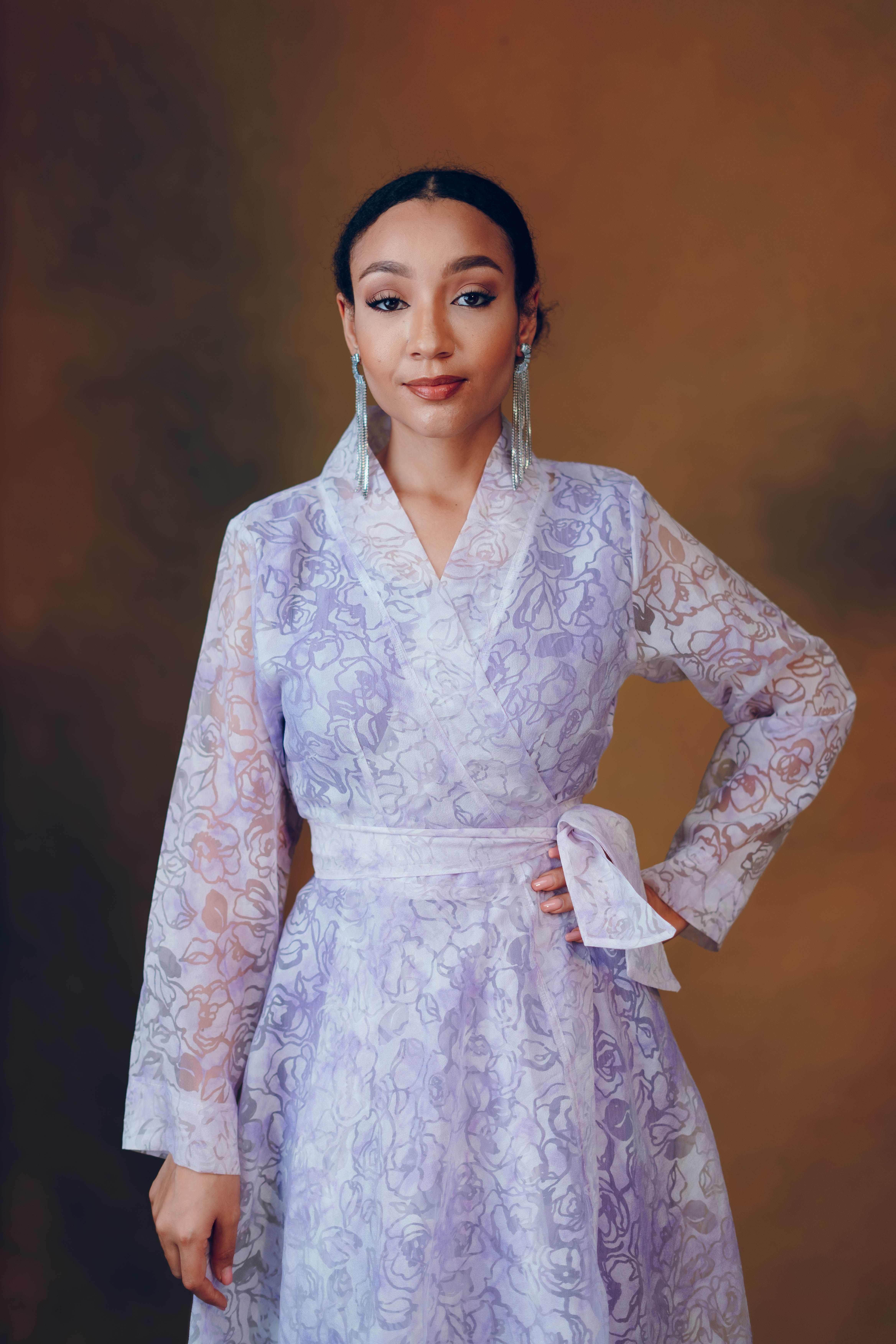 Elegant Portrait of a Stylish Woman in Lavender Dress · Free Stock Photo