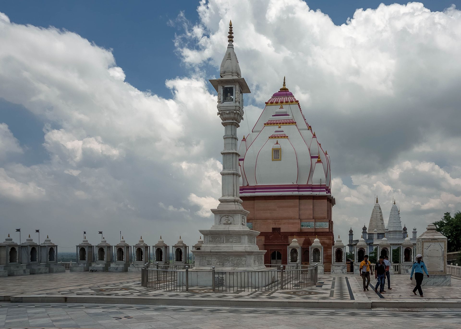 Majestic Jain temple in Bhadona, Madhya Pradesh with stunning architectural design and cloudy sky.