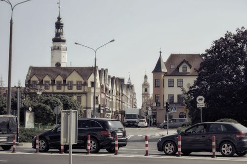 Free Picturesque street scene in Głogów, featuring historic architecture and bustling urban life. Stock Photo