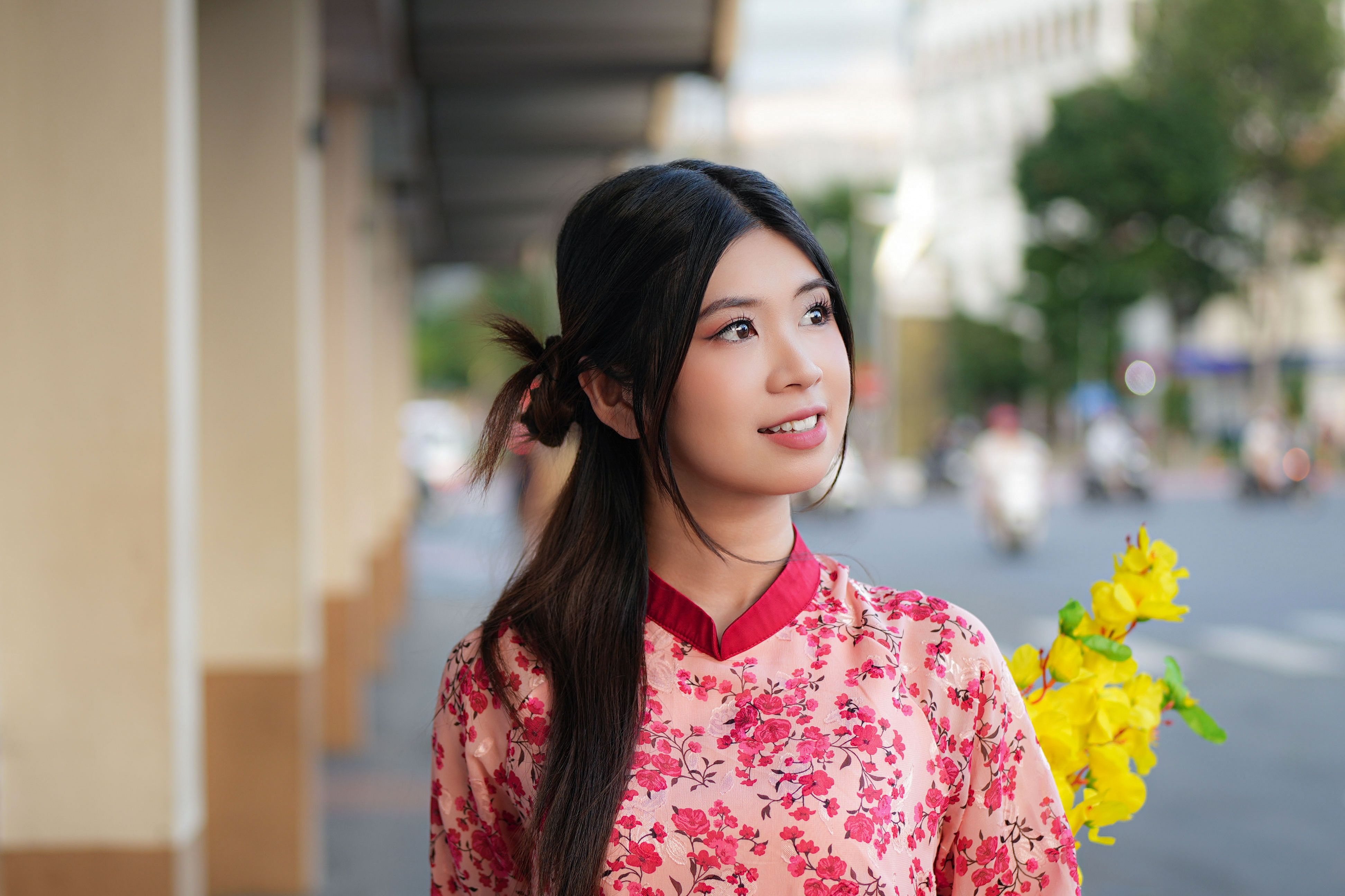 Young Woman in Traditional Floral Dress Outdoors · Free Stock Photo