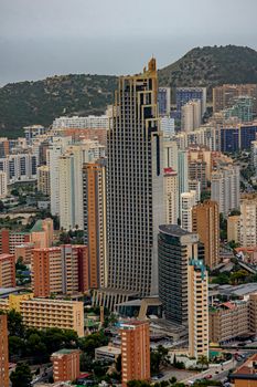 Aerial view of Benidorm's iconic skyscrapers and mountainous backdrop.