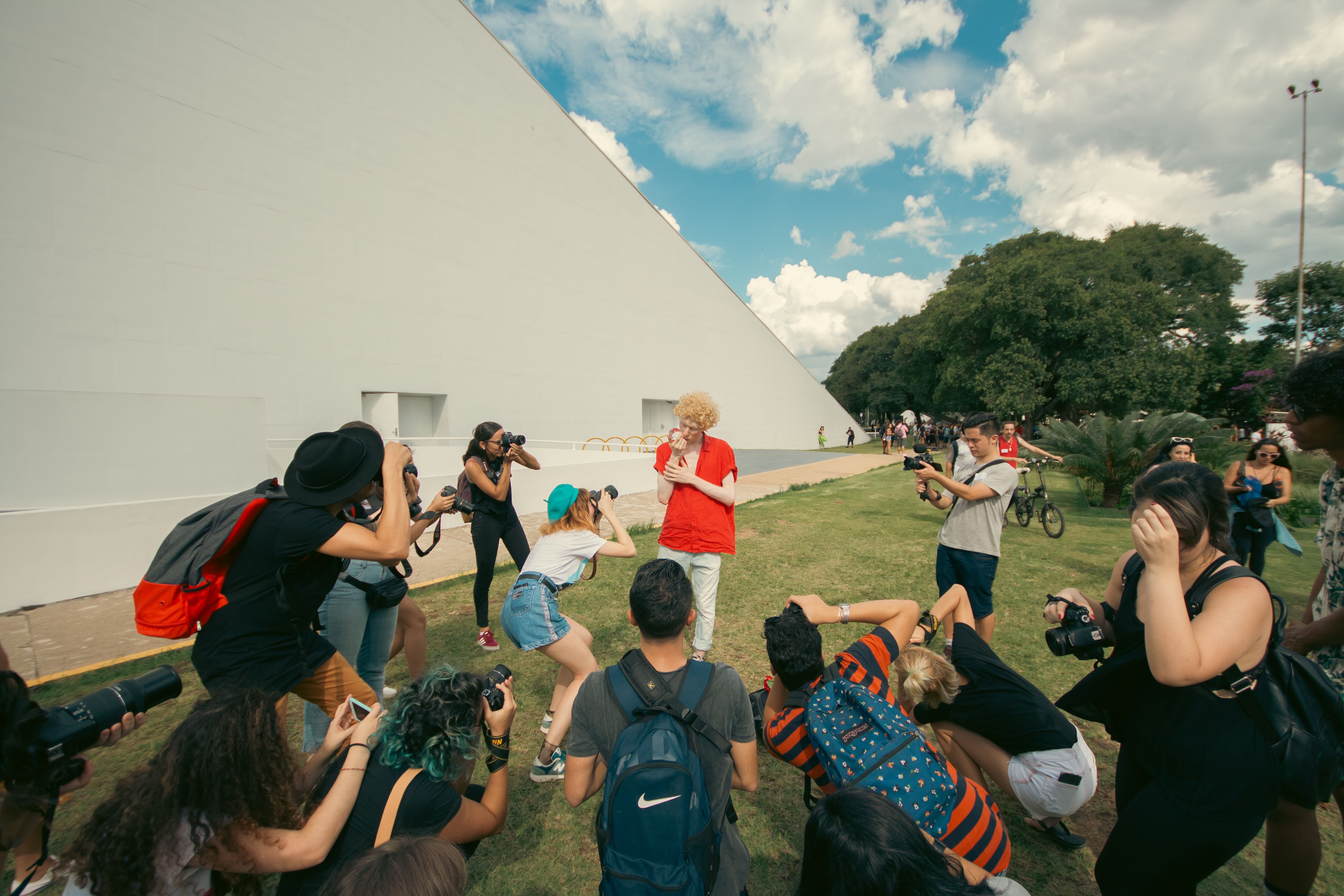 Group of Photographers Capturing Outdoor Scene · Free Stock Photo