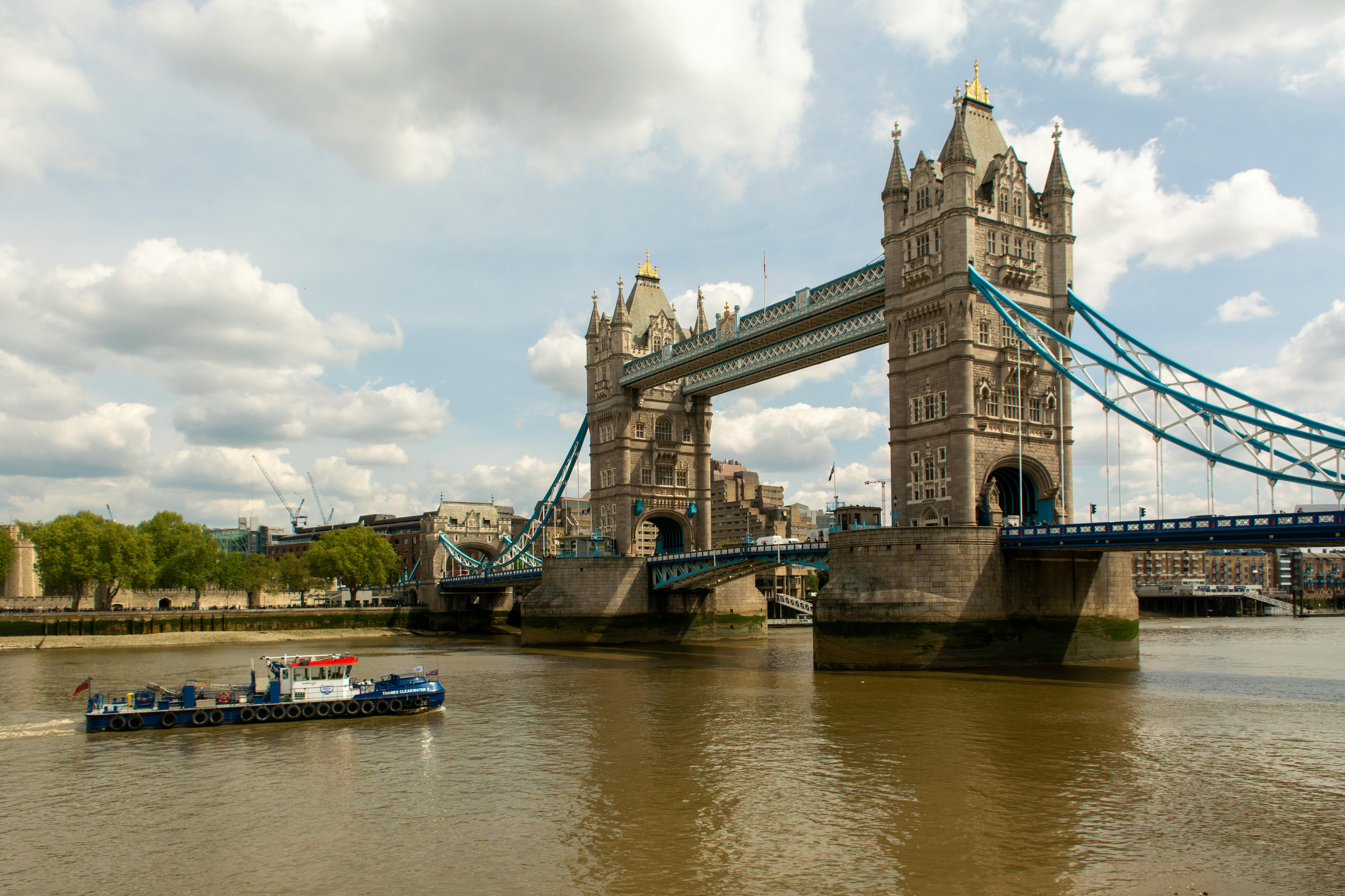 Scenic view of Tower Bridge spanning Thames River in London, UK.
